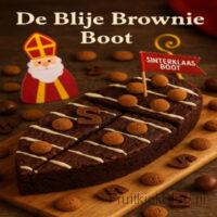 De Blije Brownie Boot - Sinterklaas Dessert 4 Een rijke, smeuïge brownie in de vorm van een vrolijke Sinterklaas Boot, gevuld met stukjes chocolade, karamel en kruidnoten. Een waar spektakelstuk voor pakjesavond!