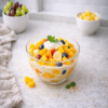 Romige Zon salade met yoghurt en kleurrijk fruit – gezonde en frisse fruitsalade.